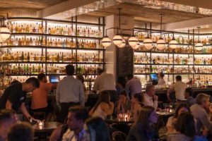 group of people gathering inside bar 1058277