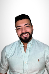 a man smiling at the camera