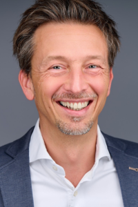 a man smiling for a picture